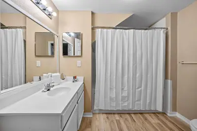 a bathroom with a sink and a shower at Cozy Themed 04 bedrooms - Close to Disney in Kissimmee