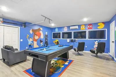 a room with a pool table in a room at Paradise Villa in Orlando