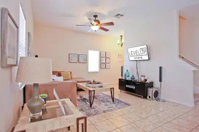 a living room with a couch and a ceiling fan at Plunge Pool Oasis Bella Vida Resort Close to Parks in Kissimmee