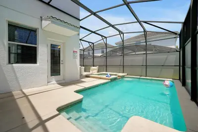 a swimming pool in the middle of a house at Family Pool Villa I Near Disney I 2 Free Clubhouses in Kissimmee