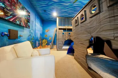 a childs room with a bed in the middle of a room at Magical Getaway Near Disney I Pool and Fun Room in Orlando