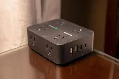 a black electronic device sitting on top of a table at NEW, Disney,10mi, Themed Rooms, PvtPool, Movie, Game Room in Kissimmee