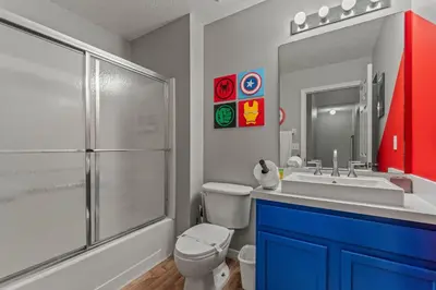 a bathroom with a toilet and a sink and a shower at Magic Getaway at Emerald Island in Kissimmee