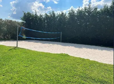 a volleyball net in the middle of a field at Magic Getaway at Emerald Island in Kissimmee