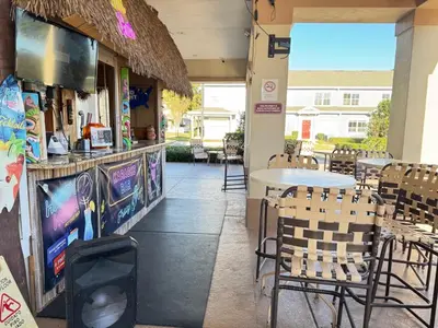 a restaurant with chairs and a table and a counter at 4 Bedroom 3 Bathroom Villas At Seven Dwarfs 18-108 in Kissimmee