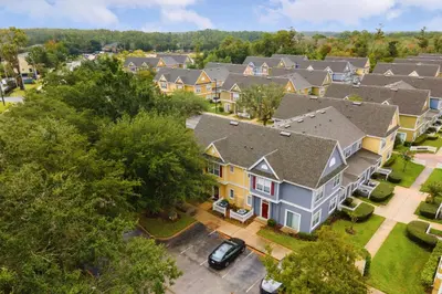 an aerial view of homes in a residential neighborhood at 4 Bedroom 3 Bathroom Villas At Seven Dwarfs 18-108 in Kissimmee