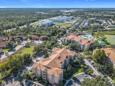 an aerial view of a building with a park at Windsor Hills 3BR - Mickey Themed Spacious Condo in Orlando