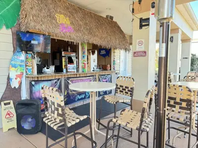 a table and chairs in front of a restaurant at 3 Bedroom 2 Bathroom Villas At Seven Dwarfs 20-104 in Kissimmee