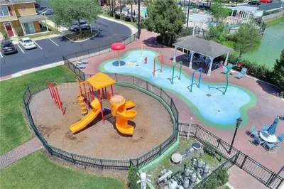 an aerial view of a park with a playground at 3 Bedroom 2 Bathroom Villas At Seven Dwarfs 20-104 in Kissimmee