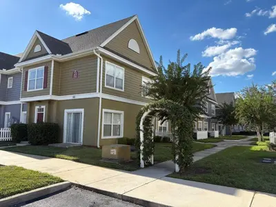 a house with a tree in front of it at 3 Bedroom 2 Bathroom Villas At Seven Dwarfs 20-104 in Kissimmee