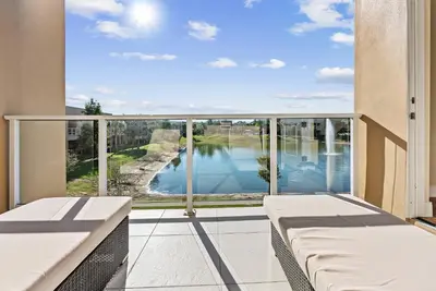 a balcony with a view of the water at Home Luxury 03 Beds Close Disney At Magic Village in Orlando