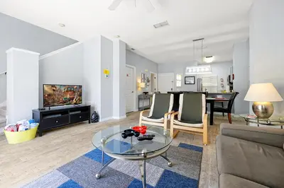 a living room with a couch and a table at 8567 BAY LILY LOOP 3 BED in Kissimmee