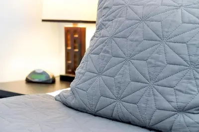 a close up of a bed with a pillow on it at 8567 BAY LILY LOOP 3 BED in Kissimmee