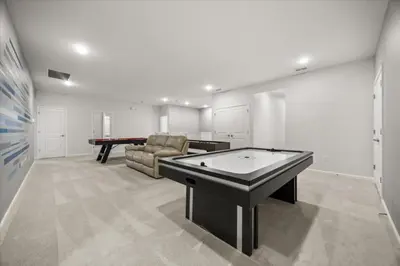 a room with a ping pong table and a pool table at 15 Bedrooms15 Bathrooms Veranda Palms 2393Sd in Kissimmee