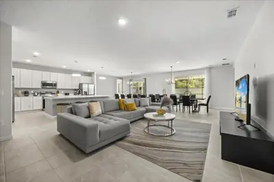 a large living room with a couch and a table at 15 Bedrooms15 Bathrooms Veranda Palms 2393Sd in Kissimmee