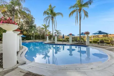 a pool at a resort with palm trees at 3 Bedrooms 3 Bathrooms Encantada Resort 3097Yl in Kissimmee
