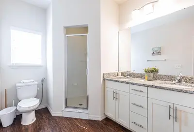 a white bathroom with a toilet and a sink at TVPM-3230WA in Kissimmee