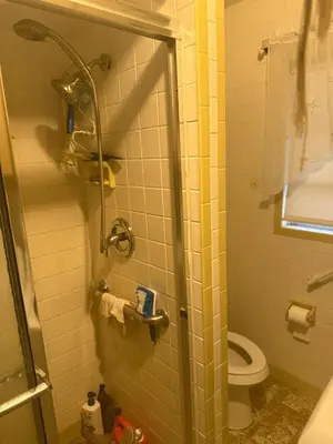 a bathroom with a shower and a toilet at Family retreat with lake views and near Disney in Saint Cloud