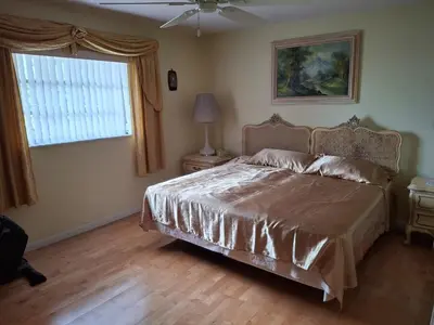 a bedroom with a bed and a window at Family retreat with lake views and near Disney in Saint Cloud
