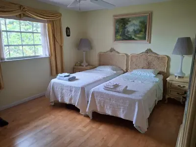 a bedroom with two beds and a window at Family retreat with lake views and near Disney in Saint Cloud