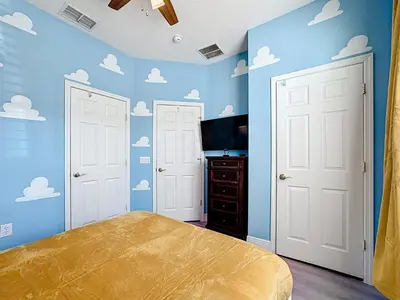 a bedroom with blue walls with clouds on the walls at T2531M Windsor Hills Resort 3Bedrm Private Pool in Orlando