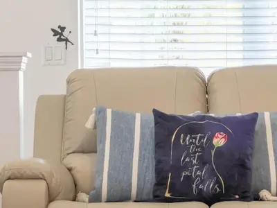 a couch with a pillow that says under the last rebel fight at OAKWATER KISSIMMEE 3 BEDS in Orlando