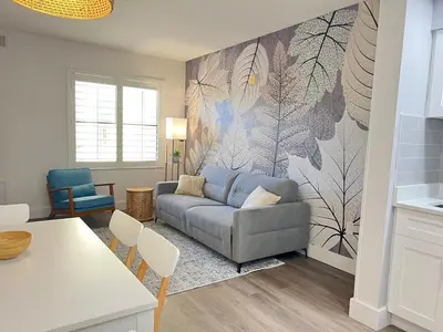a living room with a couch and a table at Suite near Epic Universe & Universal, free parking in Orlando
