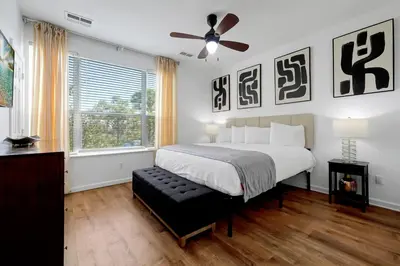 a bedroom with a bed and a ceiling fan at Beautiful Epic Universe Townhome, Vista Cay-4034 in Orlando