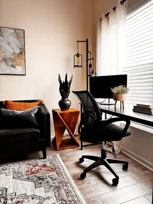 a living room with a desk and a chair at Modern 3BR Retreat with Comfort & Style Near Disney in Kissimmee