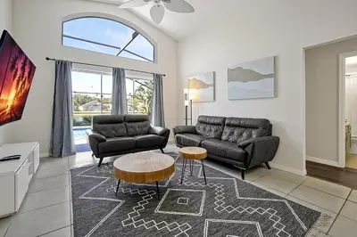 a living room with a couch and a table at 938 Lake Berkley Kissimmee FL 34746 in Kissimmee