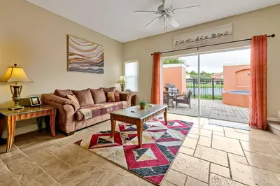 a living room with a couch and a table at 4703 Flagler Beach Way Kissimmee Florida 3BED in Kissimmee