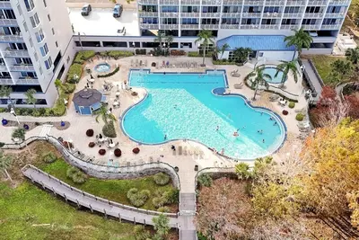 an overhead view of a swimming pool at a resort at 13427 BLUE HERRON TOWER 1 UNIT 707 ORLANDO 1 BED in Orlando