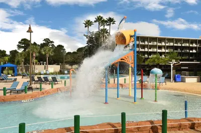 a water fountain in the middle of a pool at Wyndham Garden Lake Buena Vista – Disney Springs® Area in Orlando