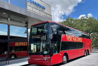 a red double decker bus parked in front of a store at Wyndham Garden Lake Buena Vista – Disney Springs® Area in Orlando