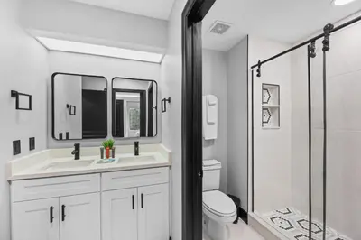 a bathroom with a toilet and a sink and a shower at Prime Location 1BR Apt Near Epic OCCC in Orlando