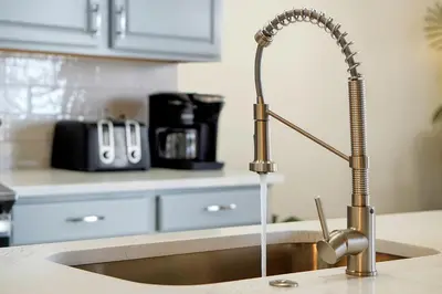 a kitchen with a sink with a faucet at 7823 BEACHFIELD KISSIMME 4BED in Orlando