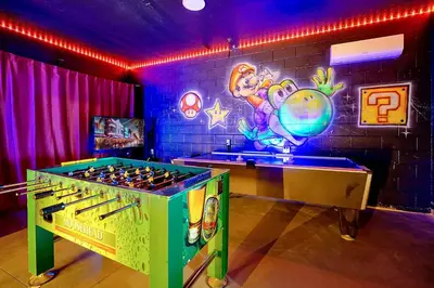 a room with a bar with a foosball table at 7823 BEACHFIELD KISSIMME 4BED in Orlando