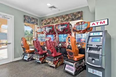 a room with a bunch of video game machines at 2554 RENSHAW ST KISSIMMEE 3BEDS in Orlando