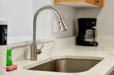 a kitchen counter with a sink in a kitchen at 8105 COCONUT PALM WAY UNIT 205 KISSIMMEE 3BEDS in Kissimmee