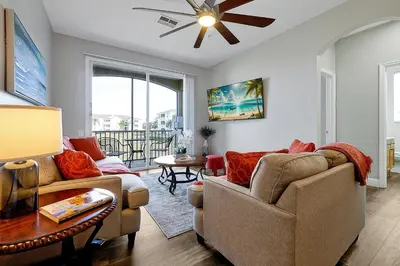 a living room with two couches and a table at 8105 COCONUT PALM WAY UNIT 205 KISSIMMEE 3BEDS in Kissimmee