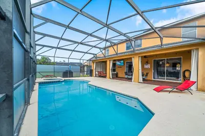 an indoor swimming pool with a glass ceiling at Emerald- 2793 in Kissimmee