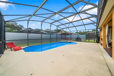 an indoor swimming pool with a glass roof at Emerald- 2793 in Kissimmee