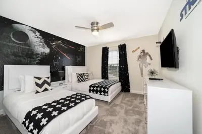 a bedroom with two beds and a wall mural at Stunning Retreat Townhouse 4 Beds and 10 Mins to Disney With Pool in Kissimmee