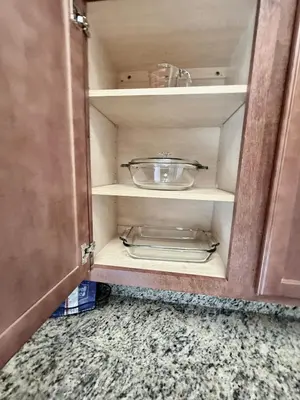 a cupboard with a bowl on top of it at Entire Condo - 3Bed 2Bath- 5 mins to Disney Park in Orlando