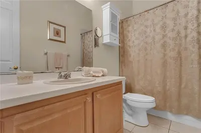 a bathroom with a sink and a toilet at Formosa Villa with Private Pool & 5 Miles to Disney in Orlando