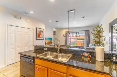 a kitchen with a sink and a counter top at 3027 Encantada in Kissimmee