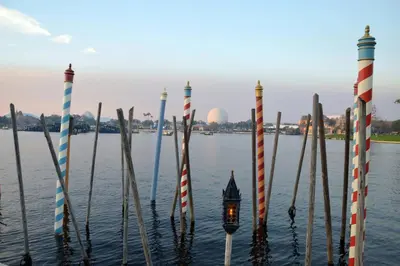 a group of poles in the water with a lantern at 3027 Encantada in Kissimmee