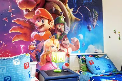 a bedroom with a mario party mural on the wall at Private Hot Tub Terra Verde Resort Pool Themed Rooms in Kissimmee