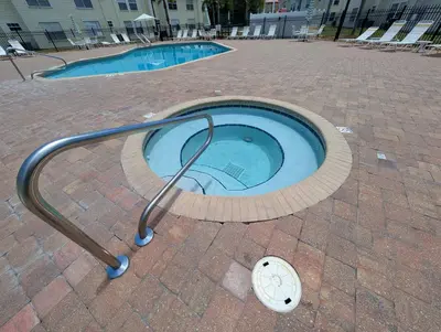 a small swimming pool with a hand rail around it at Great for Families 1-4 Kids! Near Disney, Universal, Shopping, Dining in Kissimmee