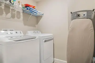 a laundry room with a washer and dryer at 5 Mi to Disney 4 Master Bed Rooms and Themed in Orlando
